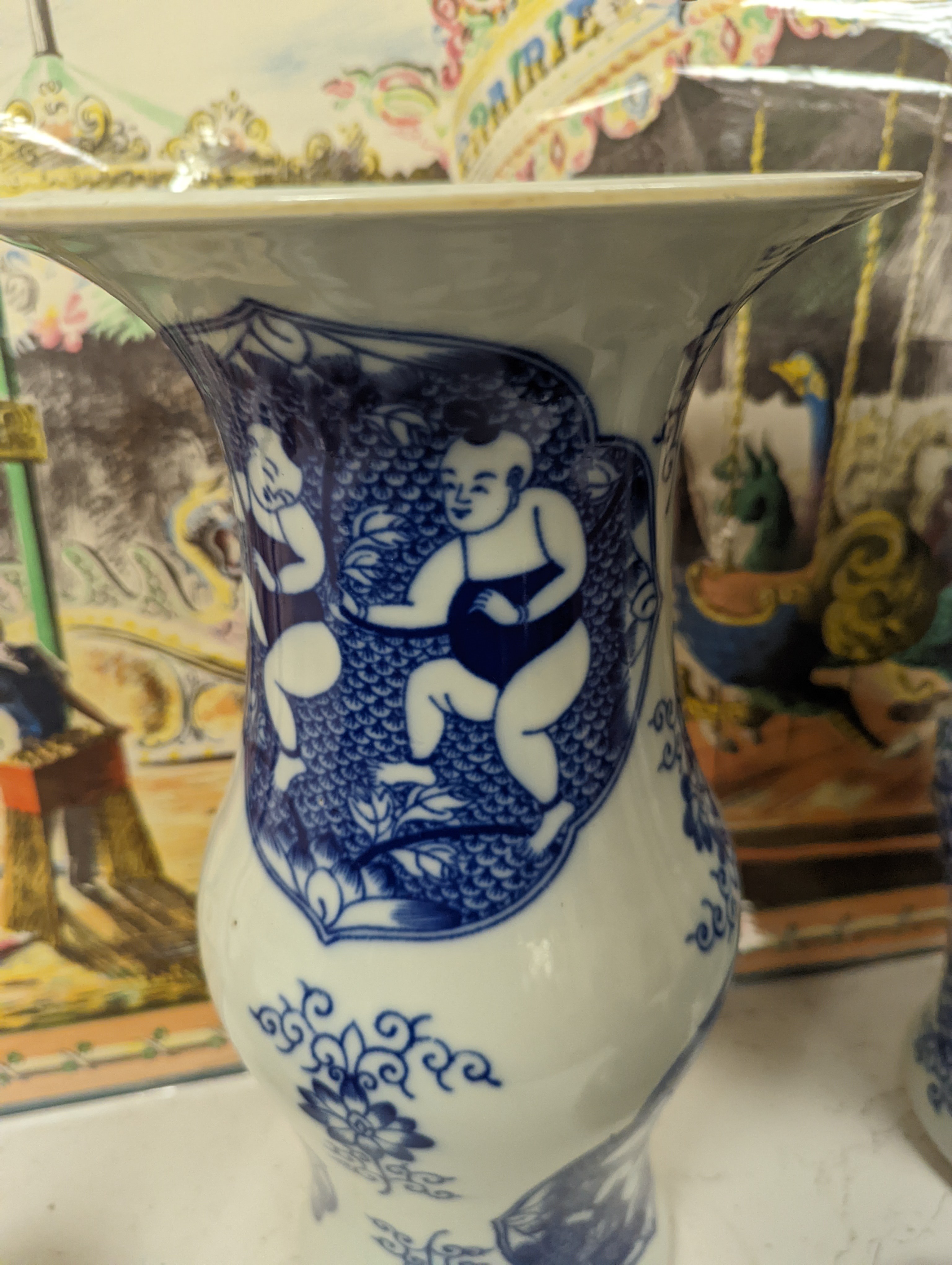 A pair of Chinese blue and white vases on stands and 6 further wood stands. Vases 35cm